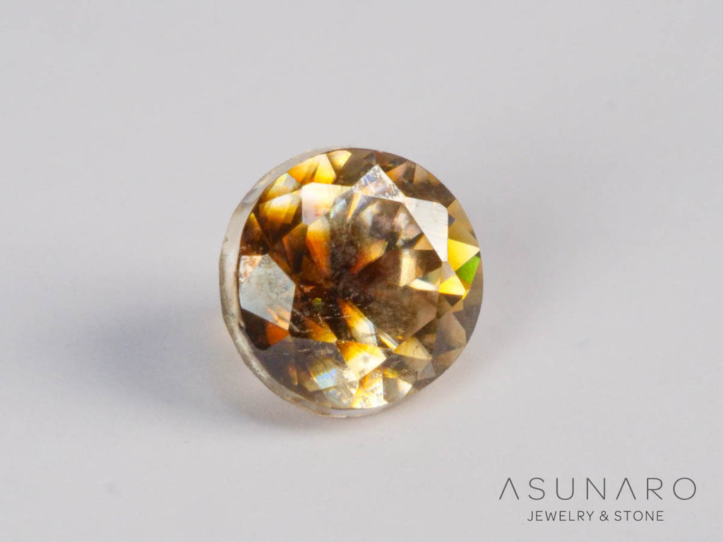 バイカラーキャシテライト  ラウンドカット　ビルマ産 　0.66ct　【250508-2946】