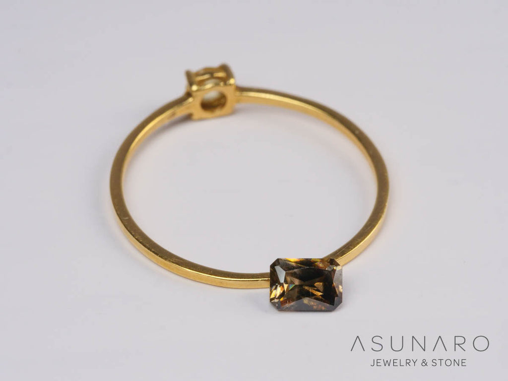 バイカラーキャシテライト  エメラルドカット　ビルマ産 　0.64ct　【250508-2951】