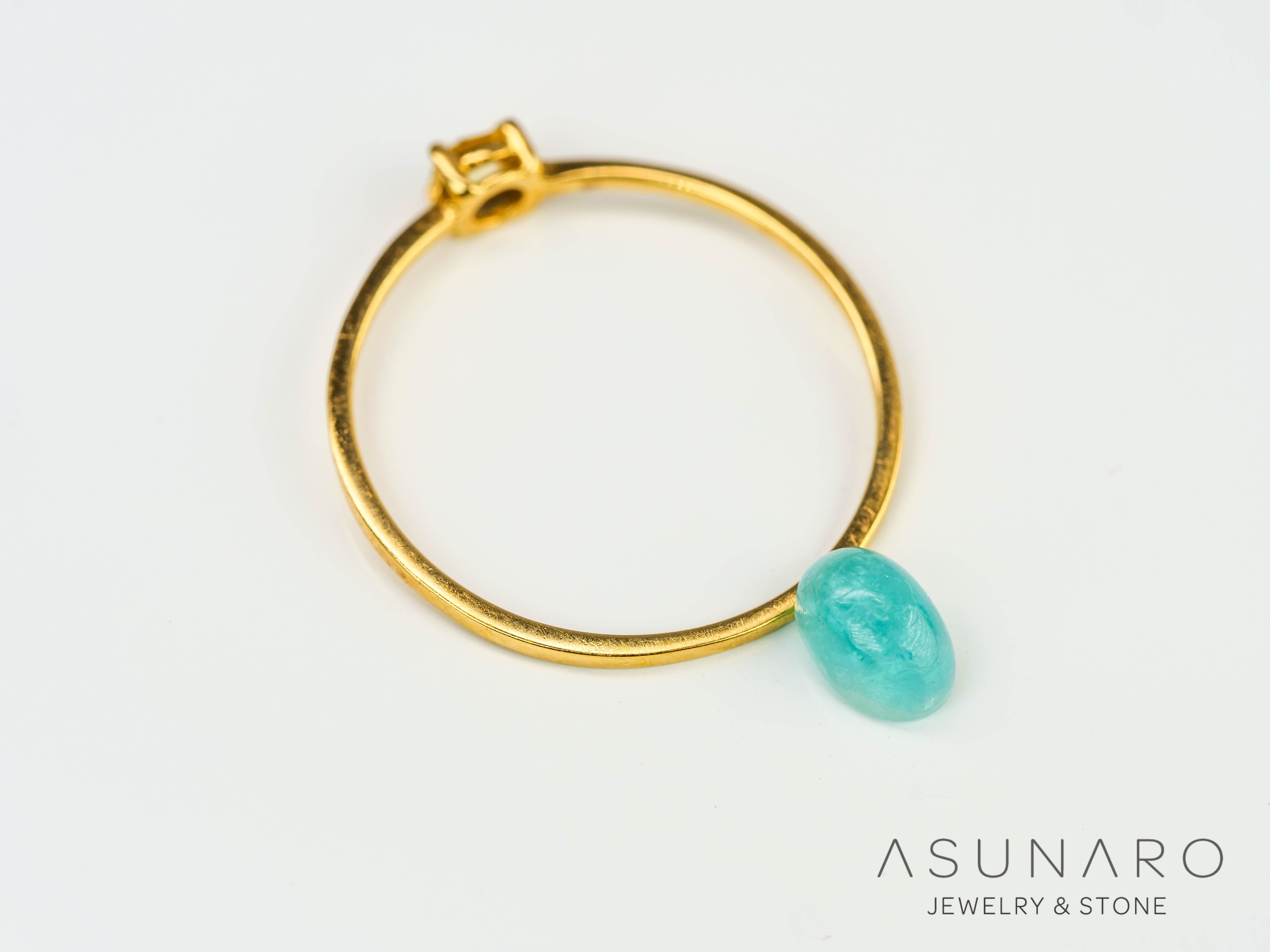 パライバトルマリン カボション ブラジル産 0.65ct 【240523-2221