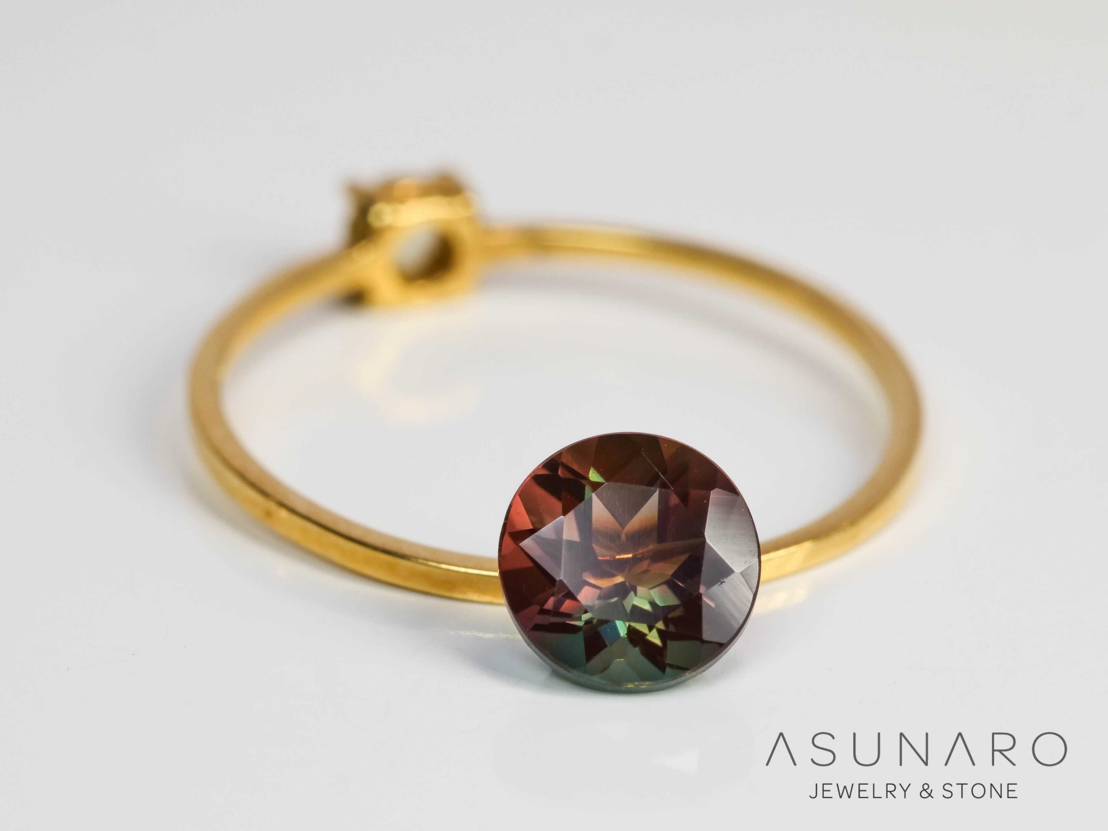 バイカラーアンデシン　ラウンドカット　チベット産　1.01ct【240903-2502】