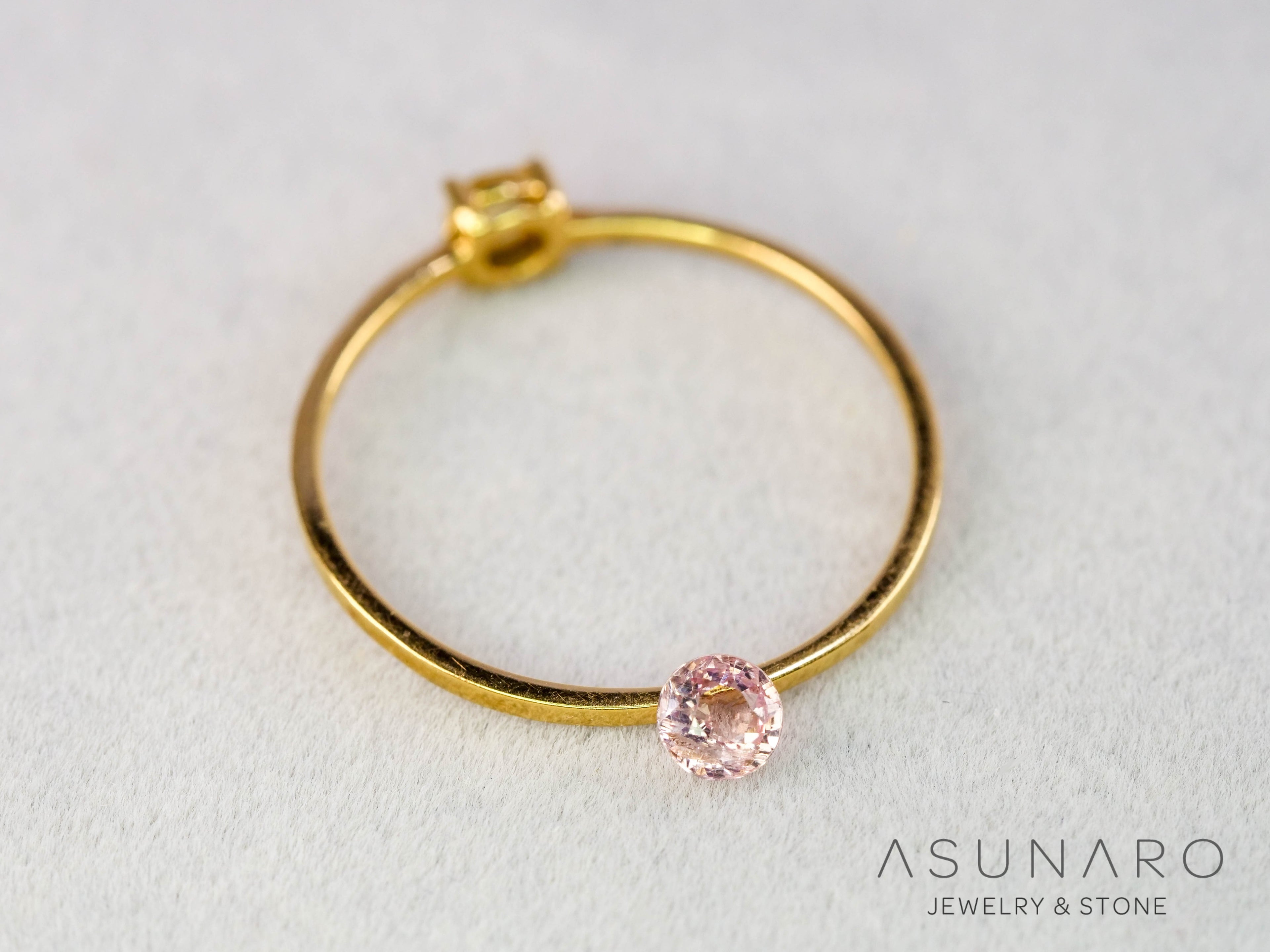 インペリアルトパーズ　ラウンドカット　0.19ct　ブラジル産　【251127-3054】