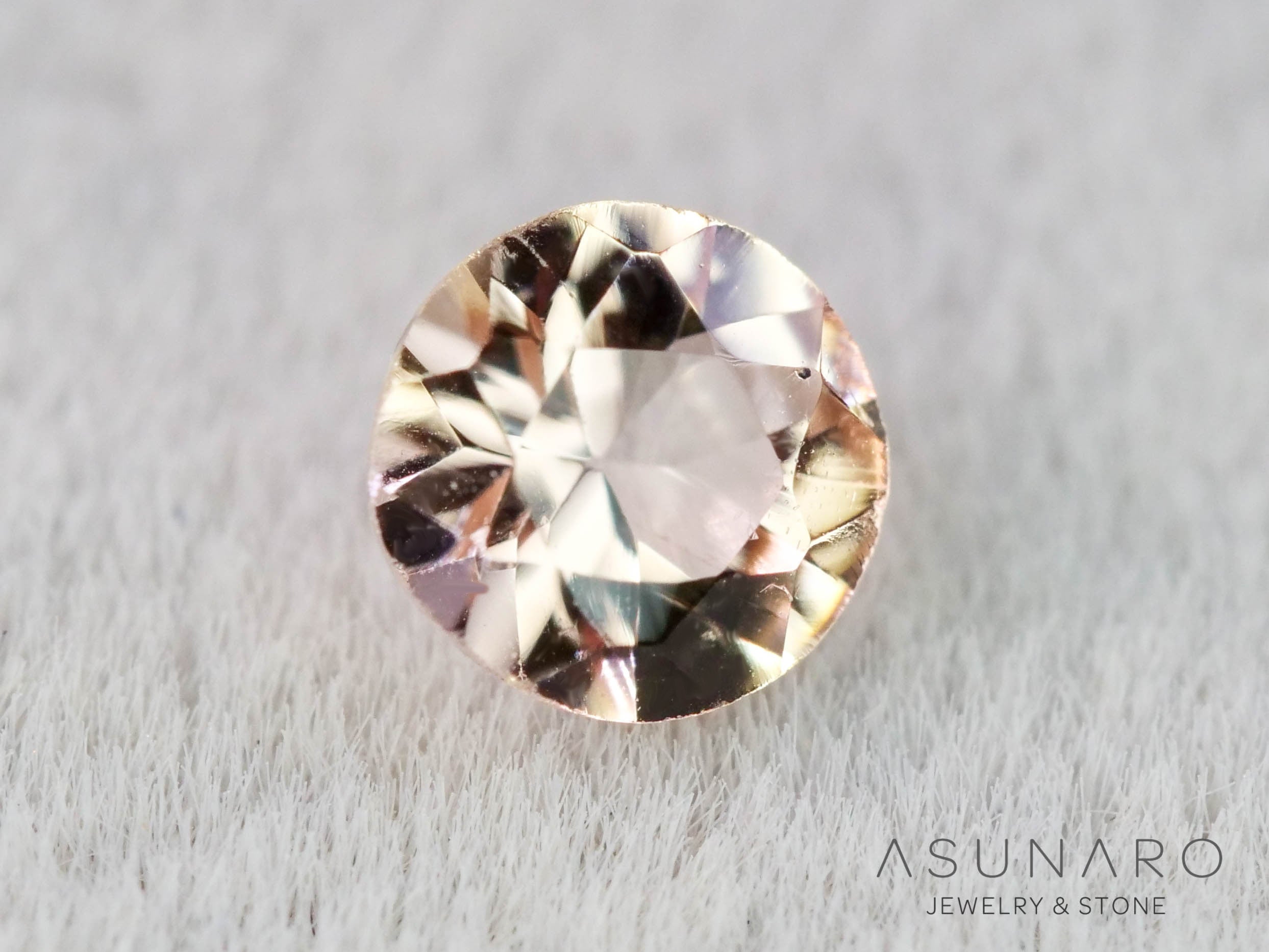 インペリアルトパーズ　ラウンドカット　0.16ct　ブラジル産　【251127-3051】