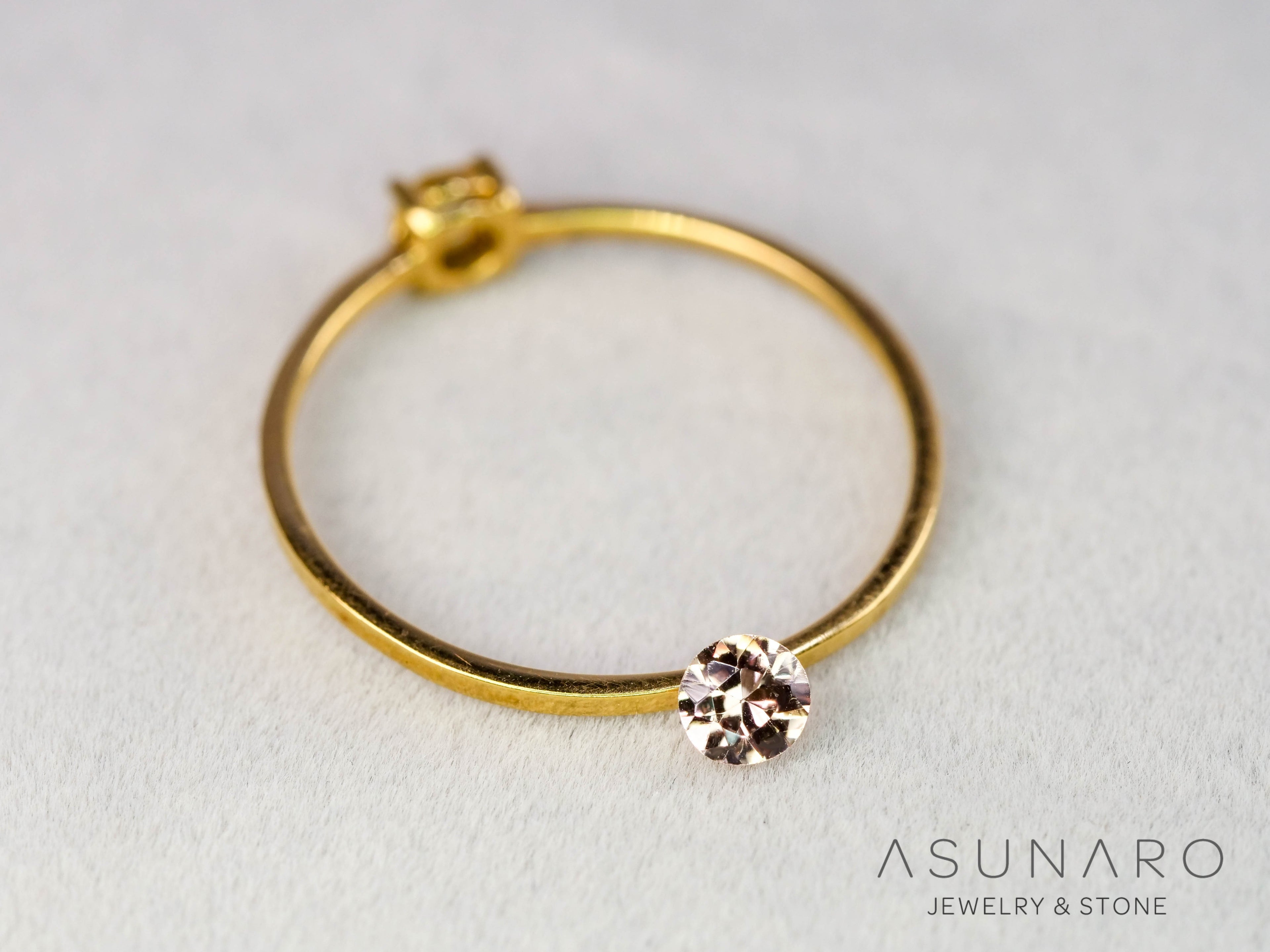 インペリアルトパーズ　ラウンドカット　0.16ct　ブラジル産　【251127-3051】