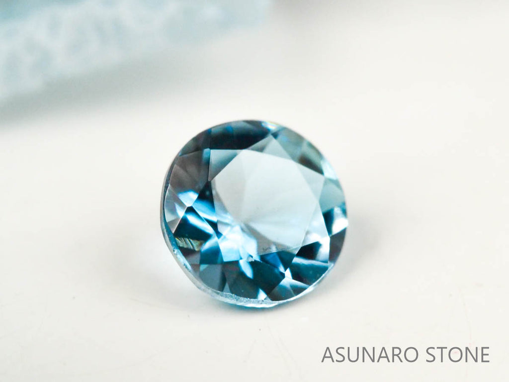 サンタマリアアクアマリン  ラウンドカット　ブラジル・タトゥー鉱山産　0.09ct【221021-1195】