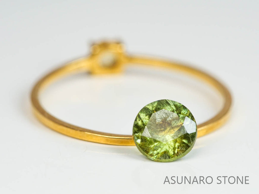 ルドウィジャイトインペリドット（ルチルペリドット）　ラウンドカット　パキスタン産   0.73ct【221226-1337】