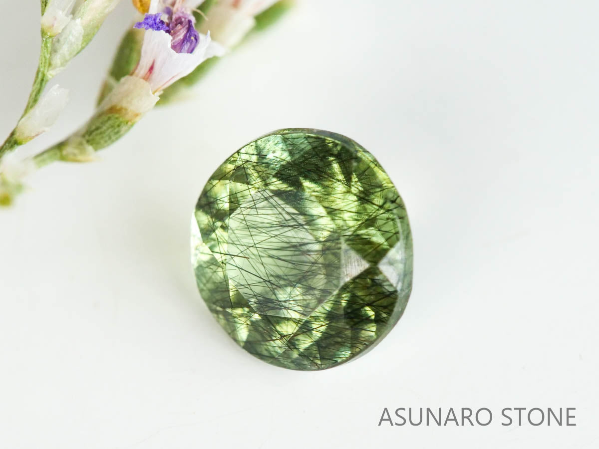 ルドウィジャイトインペリドット（ルチルペリドット）　ラウンドカット　パキスタン産   0.52ct【221226-1338】