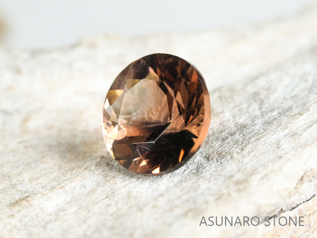 バイカラーオレゴンサンストーン ラウンドカット アメリカ産 0.73ct【os2105295】